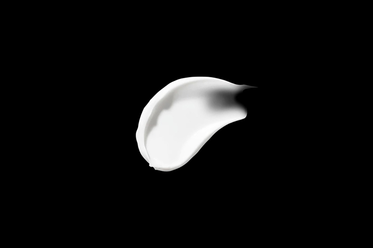 MINU sunscreen artistic smudge on black background