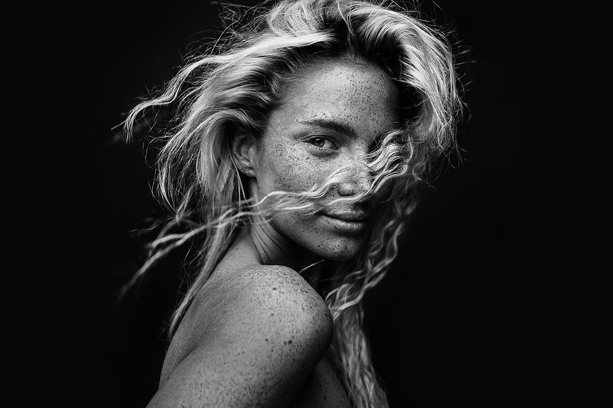close up of young blonde woman posing uv photography